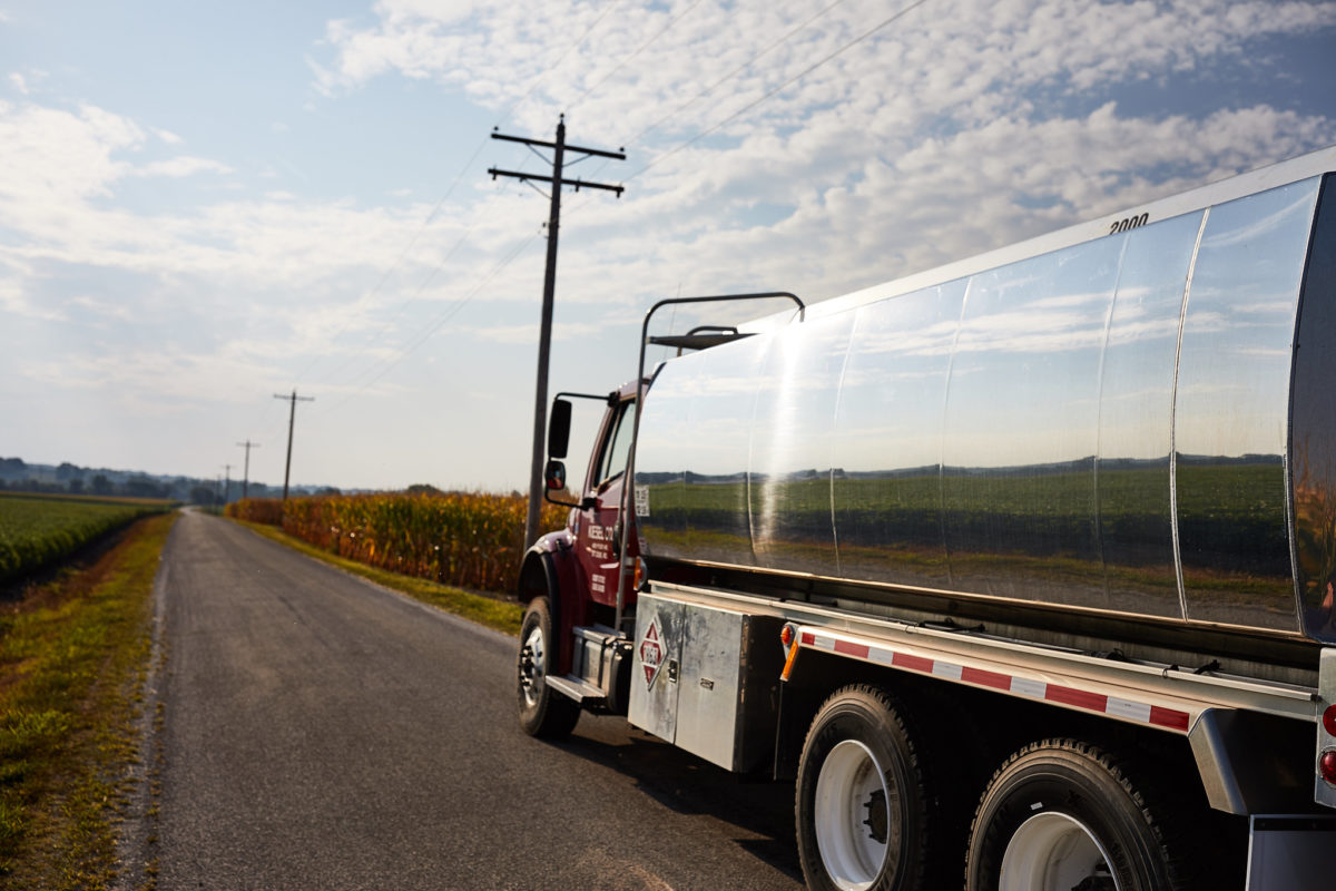 A biodiesel truck reflects a soy field off of its steel exterior.