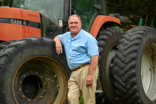 Fitzhugh Bethea III leans against a tractor at his farm in Dillon, South Carolina. The Betheas have farmed in the area for eight generations dating back to the 1700s.