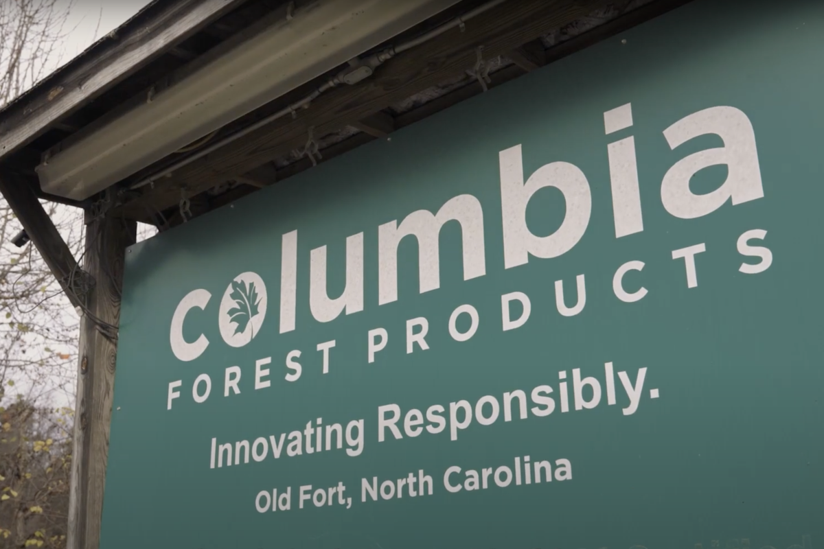 Green Columbia Forest Products sign located in Old Fort, North Carolina, with slogan “Innovating Responsibility.”